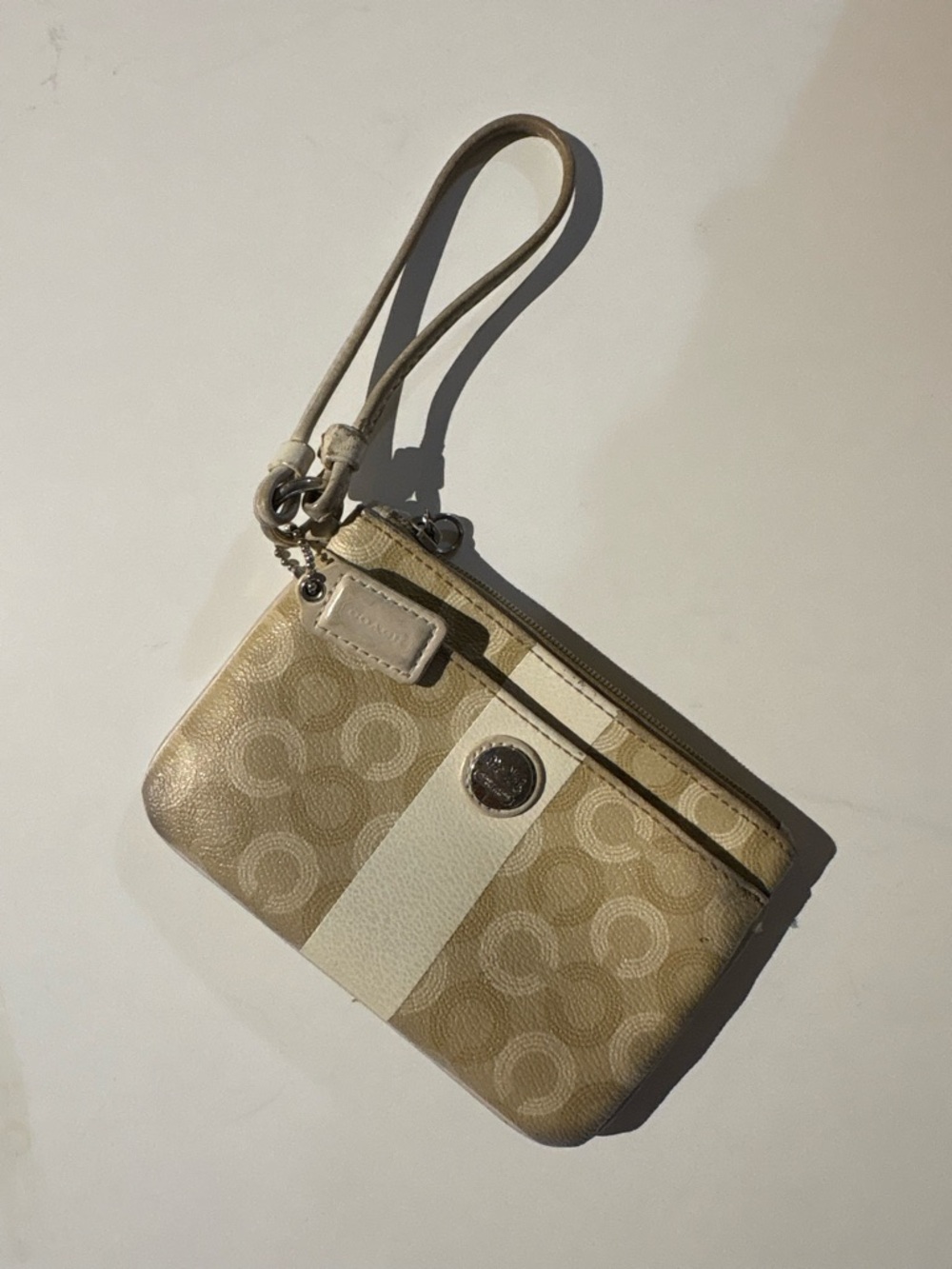 Coach Beige Wristlet with Signature Pattern and White Stripe